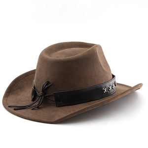 Detail of a brown suede western cowboy hat featuring black leather band and side fringe