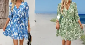 Detail view of V-neck floral chiffon dresses with ruffled sleeves and belted waist in two colors