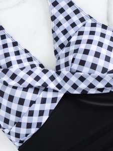 Detail of V-neck twist-front gingham swimsuit with high-stretch black bottom fabric