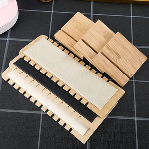 Bamboo necklace display board with velvet and leather pads for jewelry presentation