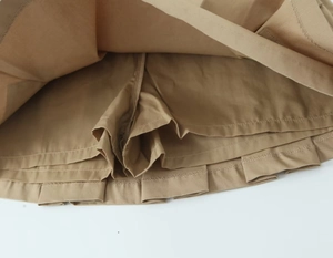 Detail view of khaki skort showing the protective inner lining and stitch quality