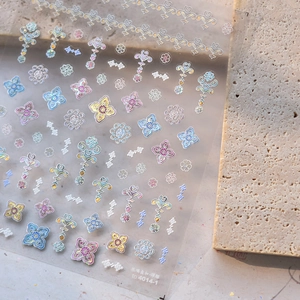Detailed 3D embossed nail stickers featuring vintage iridescent shell buckle patterns
