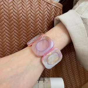 Detailed view of square resin bracelet with pink and purple marble pattern on wrist