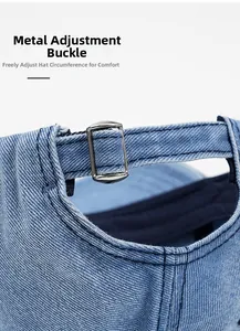 Detailed close-up of adjustable metal buckle on blue denim baseball cap for custom fit