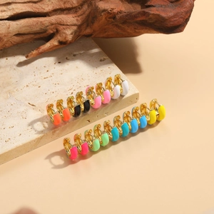 Close-up of colorful enamel round earrings set in high-quality gold plating detail