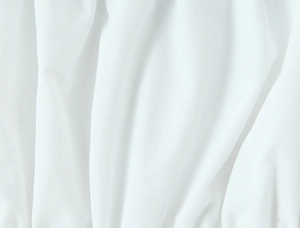 Close-up of white fabric texture showing detailed weave and soft natural folds