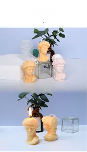 Detailed view of David bust silicone candle molds and finished handmade aroma candles