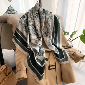 French style silk square scarf with green landscape print on classic beige trench coat