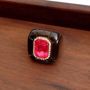 Detailed close-up of a vintage resin hexagon ring featuring a pink gemstone and crystals