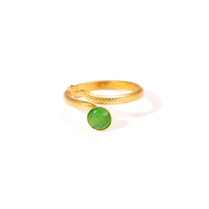 Close-up of golden snake texture ring featuring an inlaid green round gemstone