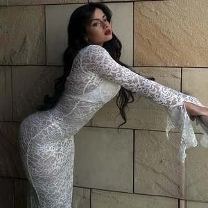 Elegant white lace long sleeve dress with deep V-neck and sheer mesh patchwork detail