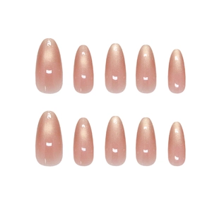 Handmade almond-shaped cat eye press-on nails in pearlescent nude pink with fine glitter