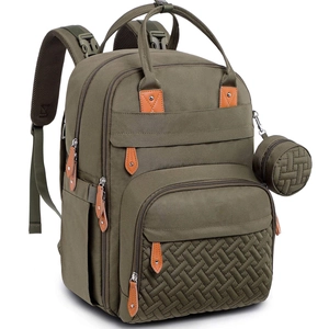 Army green diaper backpack with quilted front pocket and round coin purse accessory