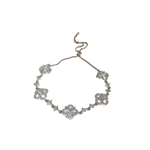 Silver clover zircon bracelet with white shell inlays and adjustable drawstring chain