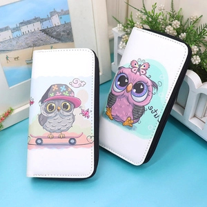 Detailed view of long zip-around wallets with cartoon owl print on white PU leather