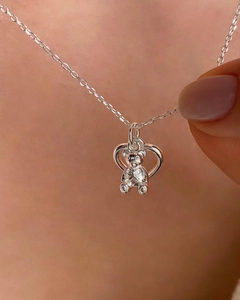 Elegant S925 sterling silver necklace featuring a cute hollow bear and heart pendant design