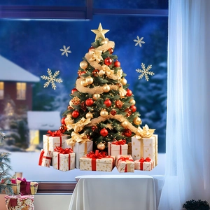 Detailed view of decorated Christmas tree with golden ornaments and gift boxes