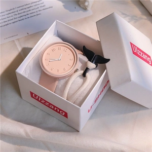 Pink minimalist watch set with whale tail bracelet in an elegant gift box presentation