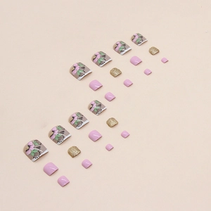 Press-on toenails featuring green leaves, pink flowers, and sparkling gold glitter finish
