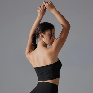 Close-up of black strapless sports tube top with side ruched detail and breathable fabric