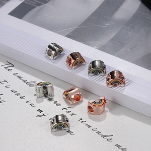 Close-up of rainbow enamel large hole beads in silver and rose gold for DIY jewelry