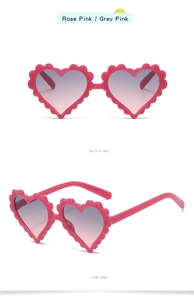 Front and side view of heart-shaped kids sunglasses in rose pink with gradient lenses