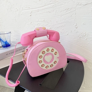 Creative pink patent leather shoulder bag featuring a unique retro telephone design