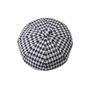 Classic black and white houndstooth beret hat in wool blend fabric with top pleat detail