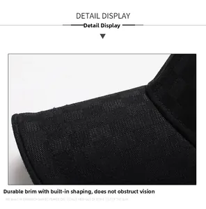Detail shot of black checkered baseball cap brim with built-in interlayer for shape retention