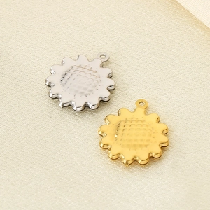 Detailed close-up of hollow sunflower pendants in silver and gold 304 stainless steel
