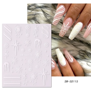 Detailed 5D embossed white nail art stickers with winter snowflakes and bowknot designs