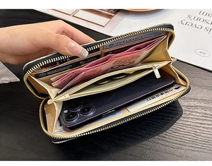 Macro detail of the large capacity interior with card slots and phone pocket in a zip wallet