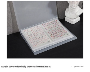 Close-up of clear acrylic nail sticker organizer album with flower patterns inside