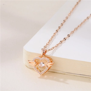 Rose gold angel wing heart necklace with sparkling zircon crystals on minimalist chain