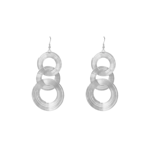 Close-up of triple-layered silver geometric hoop earrings with polished metallic finish