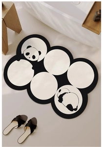 Detail of panda pattern bath mat with black and white circular splicing design