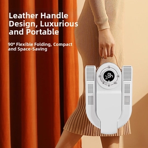 Detail of portable folding shoe dryer featuring a leather handle and digital timer knob