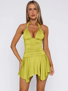 Detail of lime green ruched dress with deep V-neck and decorative gold metal rings