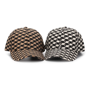 Close-up of baseball caps with 3D geometric cube patterns and premium jacquard texture