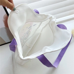 White canvas tote bag with purple handles featuring zipper and snap button closure details