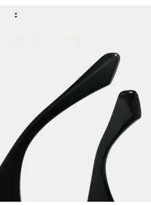 Detailed macro shot of glossy black curved mirror legs for square sunglasses