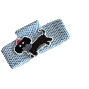 Light blue ribbed knit headband with detailed cartoon dog embroidery for women