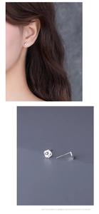 Detailed view of S925 sterling silver rose earrings with hallmark and model wearing