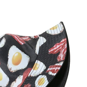Detail of reinforced stitching on black bucket hat with fried egg and bacon print