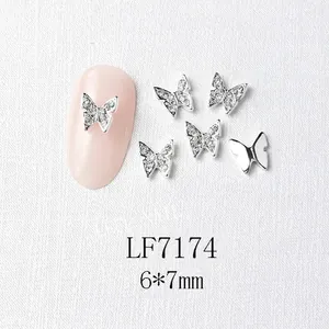 Detailed view of silver butterfly nail charms with micro-pave crystals in 6x7mm size