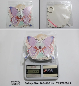 Detailed view of 3D gradient paper butterflies with hanging rings and plastic needle tools