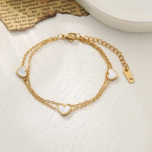 Elegant gold double-layered heart charm bracelet with 18K gold plating and white hearts