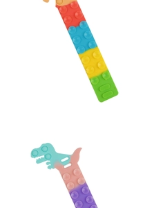 Detail of suction cup silicone sensory toy featuring rainbow strips and dinosaur shapes