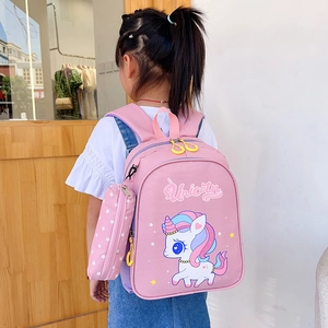 Pink cartoon unicorn backpack for girls with matching pouch and yellow zipper details