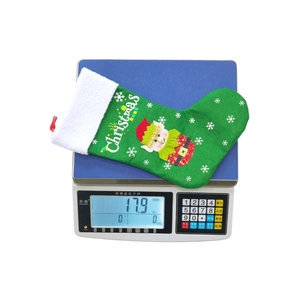 Detailed view of lightweight 17.9g green felt Christmas stocking with elf embroidery